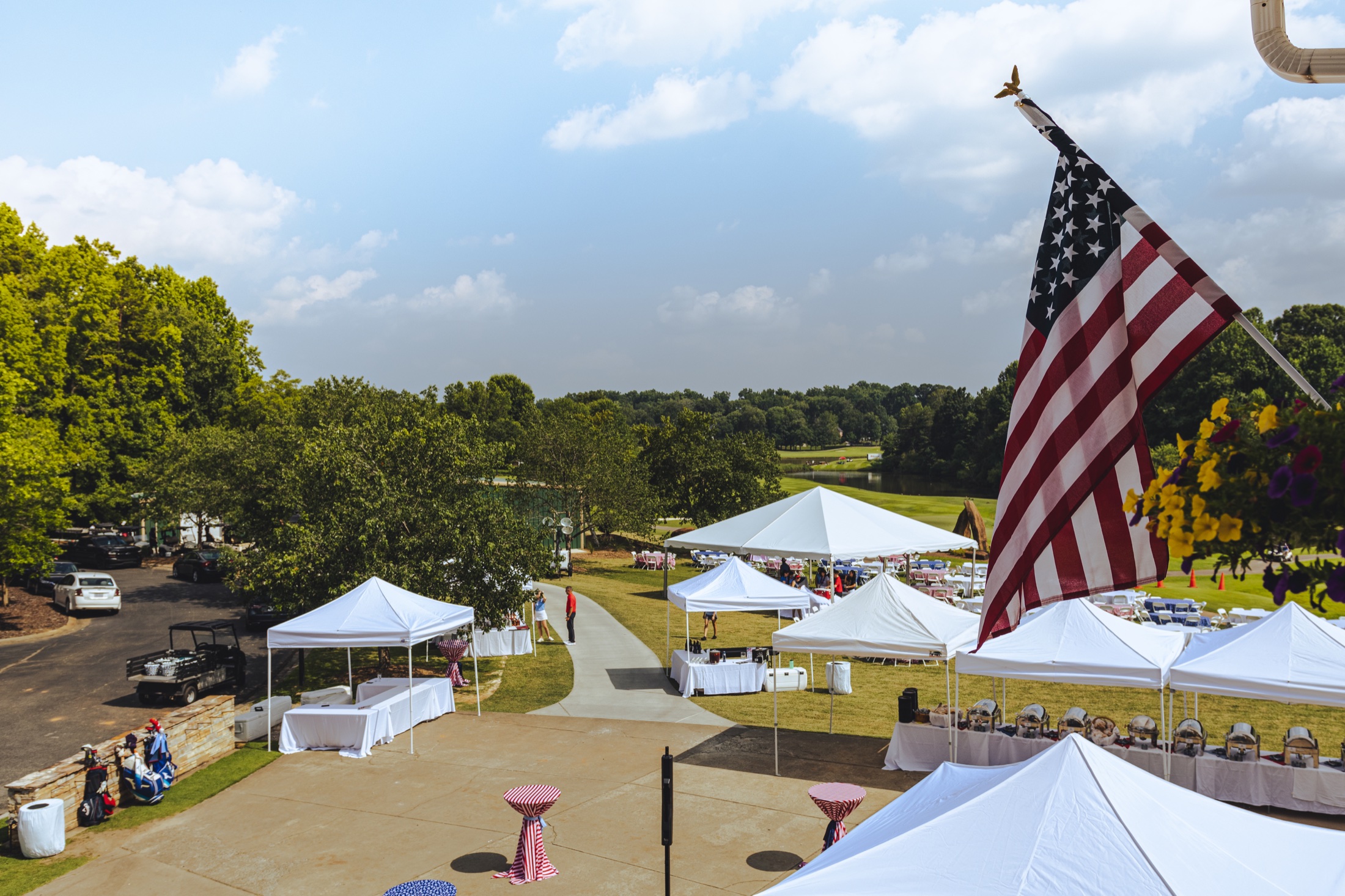 Northstone block party overlooking the golf course beneath an American flag
