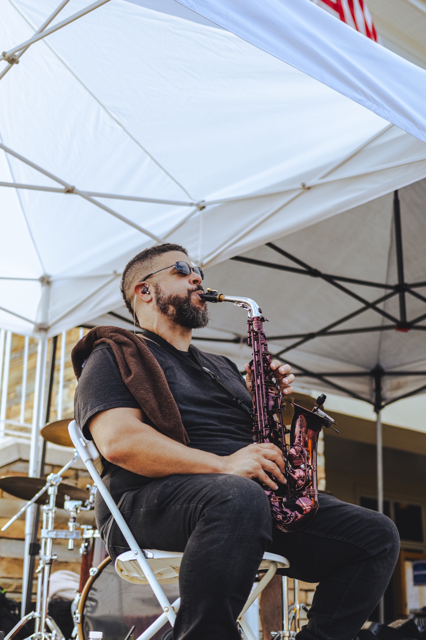 Saxophonist performing live at the Northstone block party